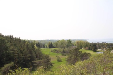 SPECTACULAR LAKE MICHIGAN VIEWS with beautiful views of the on Crooked Tree Golf Club in Michigan - for sale on GolfHomes.com, golf home, golf lot