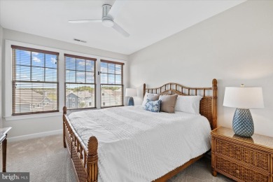 Discover your dream retreat in this stunning top-floor end unit on Bayside Resort Golf Club in Delaware - for sale on GolfHomes.com, golf home, golf lot