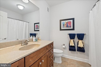 Discover your dream retreat in this stunning top-floor end unit on Bayside Resort Golf Club in Delaware - for sale on GolfHomes.com, golf home, golf lot