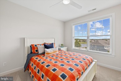 Discover your dream retreat in this stunning top-floor end unit on Bayside Resort Golf Club in Delaware - for sale on GolfHomes.com, golf home, golf lot