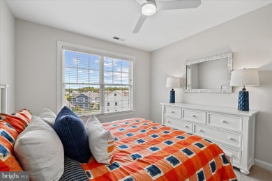 Discover your dream retreat in this stunning top-floor end unit on Bayside Resort Golf Club in Delaware - for sale on GolfHomes.com, golf home, golf lot