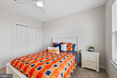 Discover your dream retreat in this stunning top-floor end unit on Bayside Resort Golf Club in Delaware - for sale on GolfHomes.com, golf home, golf lot