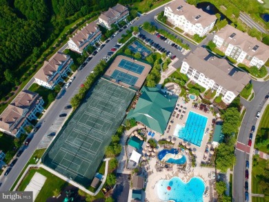 Discover your dream retreat in this stunning top-floor end unit on Bayside Resort Golf Club in Delaware - for sale on GolfHomes.com, golf home, golf lot