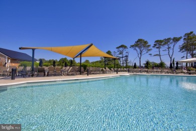 Discover your dream retreat in this stunning top-floor end unit on Bayside Resort Golf Club in Delaware - for sale on GolfHomes.com, golf home, golf lot