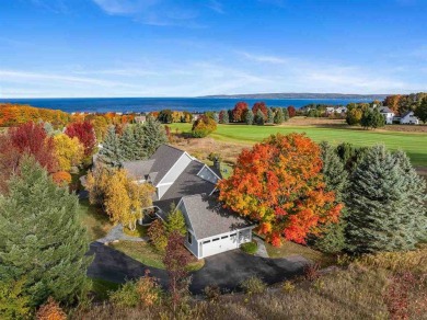 Welcome to this exquisite 4-bedroom, 4-bath home nestled in the on Crooked Tree Golf Club in Michigan - for sale on GolfHomes.com, golf home, golf lot