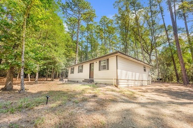 Nestled in the serene embrace of Rayburn Country Resort on Lake on Rayburn Country Club in Texas - for sale on GolfHomes.com, golf home, golf lot