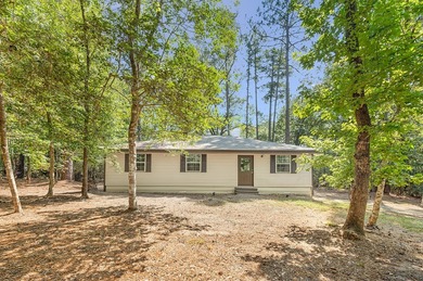 Nestled in the serene embrace of Rayburn Country Resort on Lake on Rayburn Country Club in Texas - for sale on GolfHomes.com, golf home, golf lot