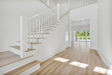 Experience elevated coastal living in the Suffolk II by Romair on Origins Golf Club in Florida - for sale on GolfHomes.com, golf home, golf lot