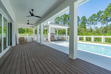 Experience elevated coastal living in the Suffolk II by Romair on Origins Golf Club in Florida - for sale on GolfHomes.com, golf home, golf lot