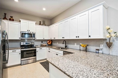 This fabulous and updated villa on the 10th hole overlooking the on Kings Gate Golf Club in Florida - for sale on GolfHomes.com, golf home, golf lot