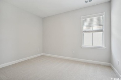 Fall in love with this 3-bedroom, 2.5-bath home in the heart of on Tidewater Golf Club and Plantation in South Carolina - for sale on GolfHomes.com, golf home, golf lot