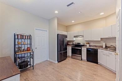 Enjoy maintenance-free Florida living in the highly sought-after on East Bay Golf Club in Florida - for sale on GolfHomes.com, golf home, golf lot