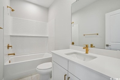 Fall in love with this 3-bedroom, 2.5-bath home in the heart of on Tidewater Golf Club and Plantation in South Carolina - for sale on GolfHomes.com, golf home, golf lot