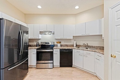 Enjoy maintenance-free Florida living in the highly sought-after on East Bay Golf Club in Florida - for sale on GolfHomes.com, golf home, golf lot