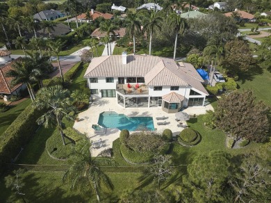 This stunning home sits on almost an acre in the estate section on Pine Tree Golf Club in Florida - for sale on GolfHomes.com, golf home, golf lot