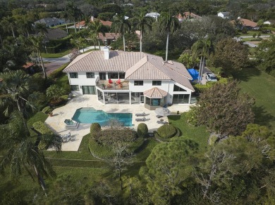 This stunning home sits on almost an acre in the estate section on Pine Tree Golf Club in Florida - for sale on GolfHomes.com, golf home, golf lot