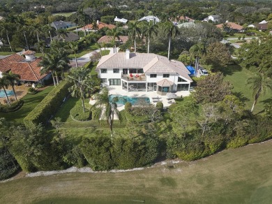 This stunning home sits on almost an acre in the estate section on Pine Tree Golf Club in Florida - for sale on GolfHomes.com, golf home, golf lot