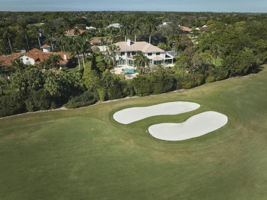 This stunning home sits on almost an acre in the estate section on Pine Tree Golf Club in Florida - for sale on GolfHomes.com, golf home, golf lot