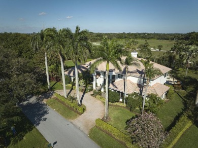 This stunning home sits on almost an acre in the estate section on Pine Tree Golf Club in Florida - for sale on GolfHomes.com, golf home, golf lot