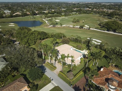 This stunning home sits on almost an acre in the estate section on Pine Tree Golf Club in Florida - for sale on GolfHomes.com, golf home, golf lot