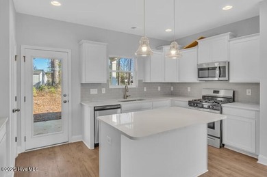 Please note: updated pictures coming soon. Interior photos are on Harbour Point Golf Club in North Carolina - for sale on GolfHomes.com, golf home, golf lot