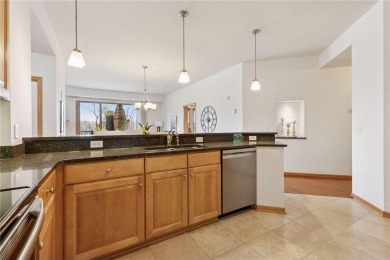 Spacious two-bedroom, two bathroom condo has walls of windows in on The Chaska Par 30 Golf Course in Minnesota - for sale on GolfHomes.com, golf home, golf lot