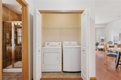 Spacious two-bedroom, two bathroom condo has walls of windows in on The Chaska Par 30 Golf Course in Minnesota - for sale on GolfHomes.com, golf home, golf lot