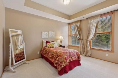 Spacious two-bedroom, two bathroom condo has walls of windows in on The Chaska Par 30 Golf Course in Minnesota - for sale on GolfHomes.com, golf home, golf lot