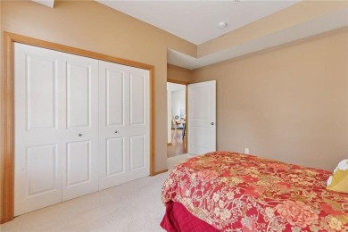 Spacious two-bedroom, two bathroom condo has walls of windows in on The Chaska Par 30 Golf Course in Minnesota - for sale on GolfHomes.com, golf home, golf lot