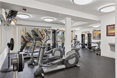 Spacious two-bedroom, two bathroom condo has walls of windows in on The Chaska Par 30 Golf Course in Minnesota - for sale on GolfHomes.com, golf home, golf lot