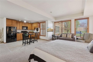Spacious two-bedroom, two bathroom condo has walls of windows in on The Chaska Par 30 Golf Course in Minnesota - for sale on GolfHomes.com, golf home, golf lot