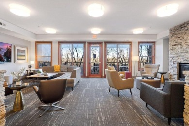 Spacious two-bedroom, two bathroom condo has walls of windows in on The Chaska Par 30 Golf Course in Minnesota - for sale on GolfHomes.com, golf home, golf lot