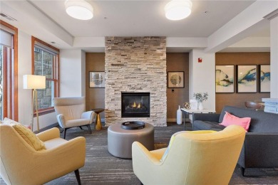 Spacious two-bedroom, two bathroom condo has walls of windows in on The Chaska Par 30 Golf Course in Minnesota - for sale on GolfHomes.com, golf home, golf lot