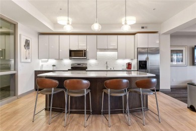Spacious two-bedroom, two bathroom condo has walls of windows in on The Chaska Par 30 Golf Course in Minnesota - for sale on GolfHomes.com, golf home, golf lot