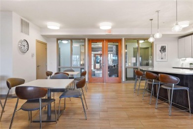 Spacious two-bedroom, two bathroom condo has walls of windows in on The Chaska Par 30 Golf Course in Minnesota - for sale on GolfHomes.com, golf home, golf lot