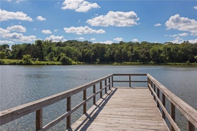 Spacious two-bedroom, two bathroom condo has walls of windows in on The Chaska Par 30 Golf Course in Minnesota - for sale on GolfHomes.com, golf home, golf lot