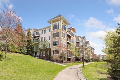 Spacious two-bedroom, two bathroom condo has walls of windows in on The Chaska Par 30 Golf Course in Minnesota - for sale on GolfHomes.com, golf home, golf lot