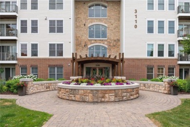 Spacious two-bedroom, two bathroom condo has walls of windows in on The Chaska Par 30 Golf Course in Minnesota - for sale on GolfHomes.com, golf home, golf lot