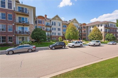 Spacious two-bedroom, two bathroom condo has walls of windows in on The Chaska Par 30 Golf Course in Minnesota - for sale on GolfHomes.com, golf home, golf lot