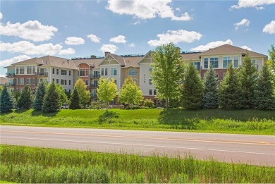 Spacious two-bedroom, two bathroom condo has walls of windows in on The Chaska Par 30 Golf Course in Minnesota - for sale on GolfHomes.com, golf home, golf lot