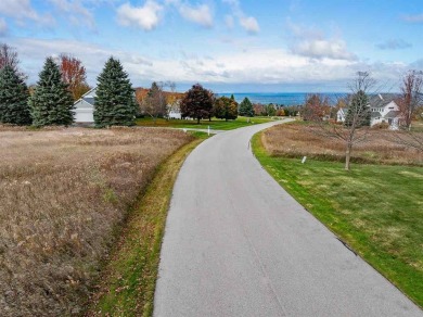 Immerse yourself in breathtaking, panoramic views of Lake on Crooked Tree Golf Club in Michigan - for sale on GolfHomes.com, golf home, golf lot