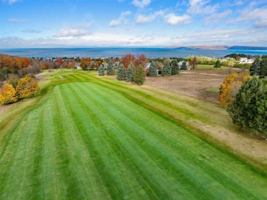 Immerse yourself in breathtaking, panoramic views of Lake on Crooked Tree Golf Club in Michigan - for sale on GolfHomes.com, golf home, golf lot