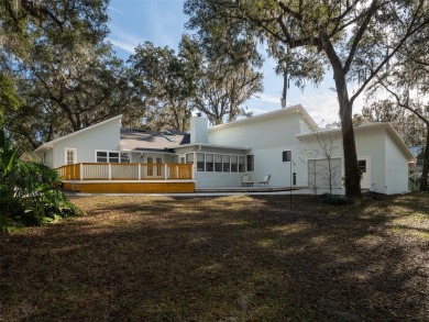 Situated on a large lot in the iconic Gainesville Country Club on Gainesville Golf and Country Club in Florida - for sale on GolfHomes.com, golf home, golf lot