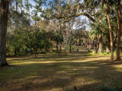 Situated on a large lot in the iconic Gainesville Country Club on Gainesville Golf and Country Club in Florida - for sale on GolfHomes.com, golf home, golf lot