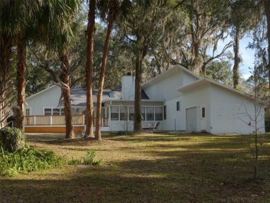 Situated on a large lot in the iconic Gainesville Country Club on Gainesville Golf and Country Club in Florida - for sale on GolfHomes.com, golf home, golf lot