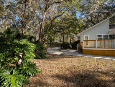 Situated on a large lot in the iconic Gainesville Country Club on Gainesville Golf and Country Club in Florida - for sale on GolfHomes.com, golf home, golf lot