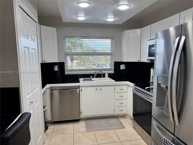 Beautiful and spacious 2BR/2Bath condo, larger than the standard on Sunrise Lakes Phase III in Florida - for sale on GolfHomes.com, golf home, golf lot