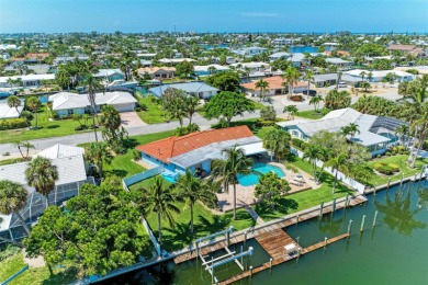 Welcome to 621 Emerald Lane, a coastal pool home on a saltwater on Key Royale Club in Florida - for sale on GolfHomes.com, golf home, golf lot