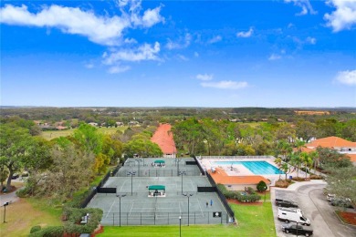 Nestled within the exclusive, gated enclave of Lake Jovita, this on Lake Jovita Golf and Country Club in Florida - for sale on GolfHomes.com, golf home, golf lot