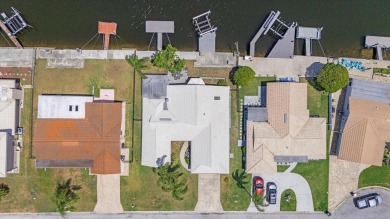 Welcome to Your Waterfront Dream Home at 4918 Forecastle Dr in on Gulf Harbors Golf Course in Florida - for sale on GolfHomes.com, golf home, golf lot